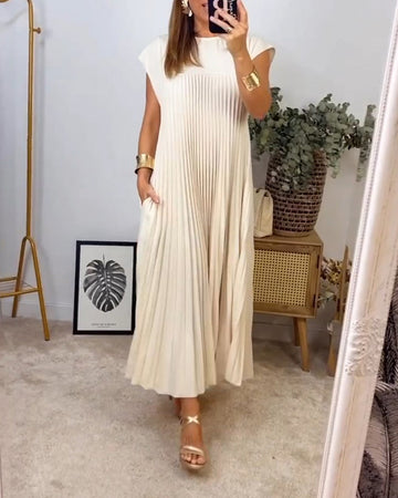 Mouwloze geplooide eenvoudige effen kleur jurk in de kleur Beige voor dames in stijl ideaal voor de herfst.