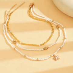 Ketting met schelp en ster