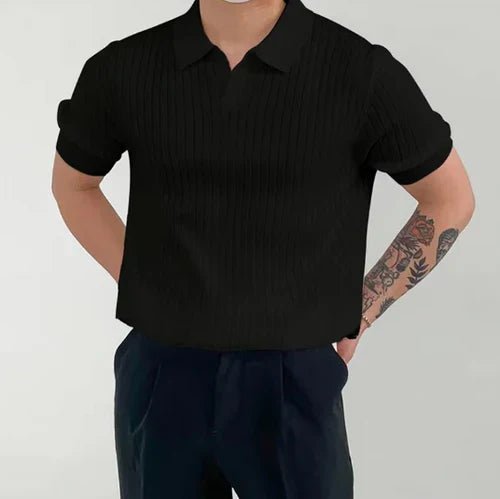 James | Ribgebreid katoenen poloshirt in de kleur Zwart voor heren in Smart-casual stijl ideaal voor de herfst.