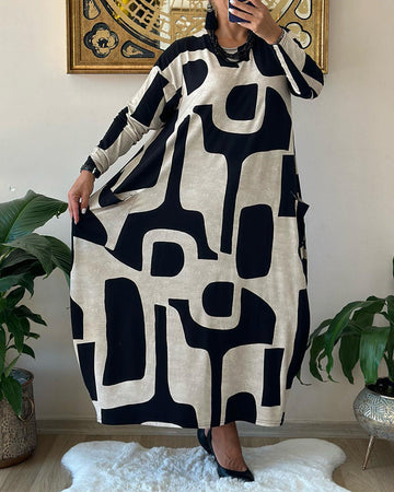 Jurk met lange mouwen en zwart witte print in de kleur Zwart voor dames in stijl ideaal voor de herfst.