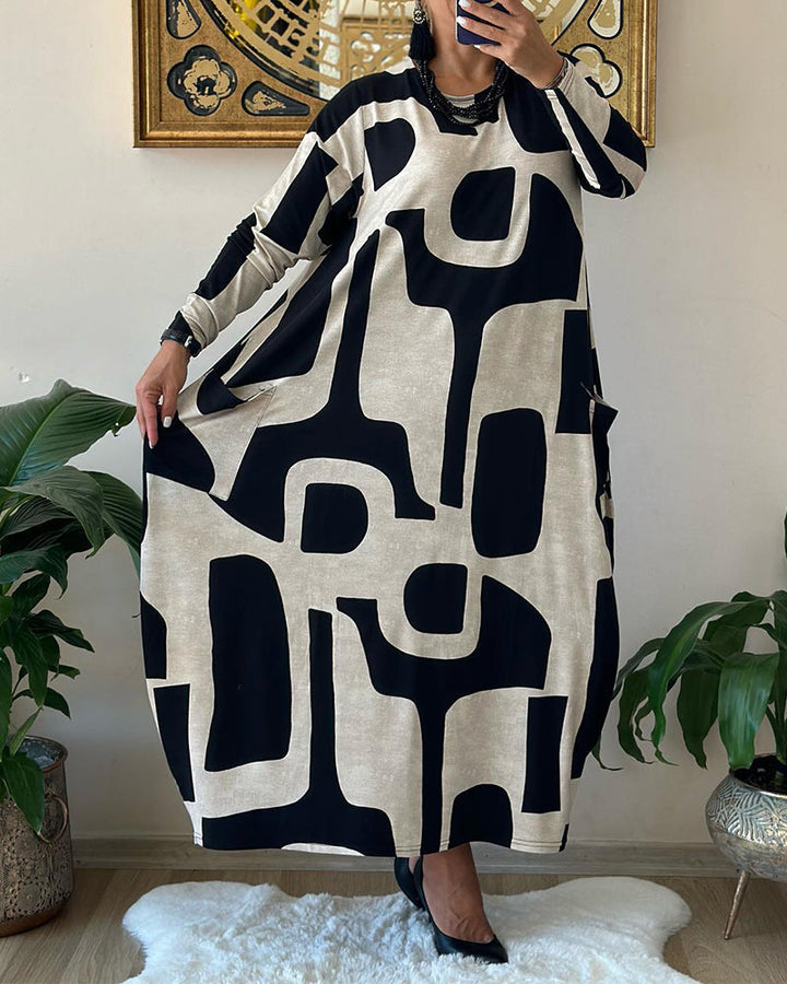 Jurk met lange mouwen en zwart witte print in de kleur Zwart voor dames in stijl ideaal voor de herfst.