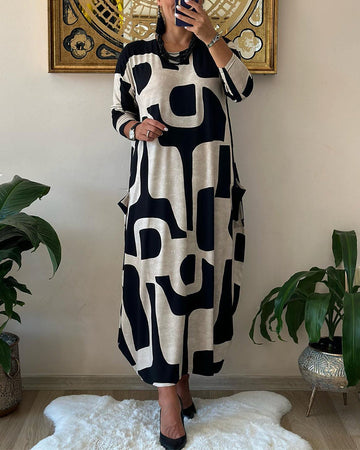 Jurk met lange mouwen en zwart witte print in de kleur Zwart voor dames in stijl ideaal voor de herfst.
