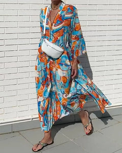 Jurk met vlotte print en V-hals in de kleur Blauw voor dames in stijl ideaal voor de lente.