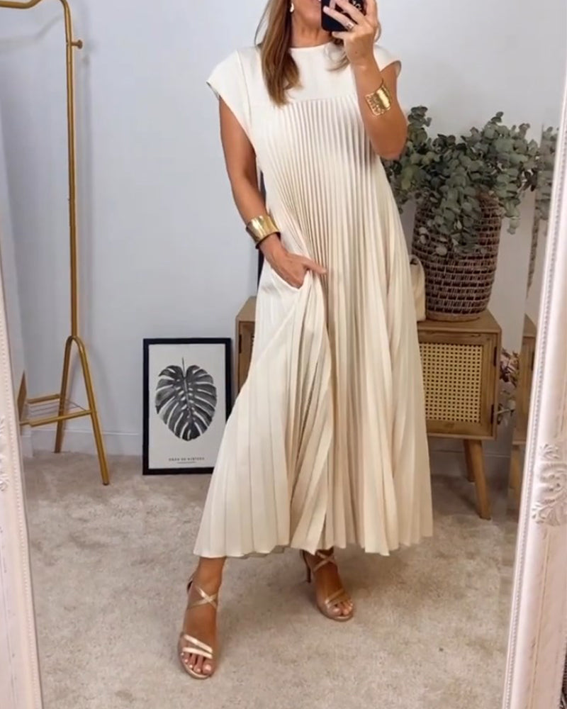 Mouwloze geplooide eenvoudige effen kleur jurk in de kleur Beige voor dames in stijl ideaal voor de herfst.