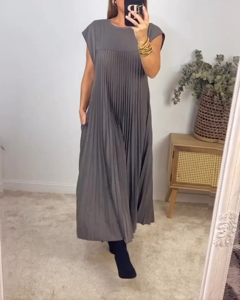 Mouwloze geplooide eenvoudige effen kleur jurk in de kleur Beige voor dames in stijl ideaal voor de herfst.