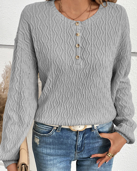 Effen topje met knopen in de kleur Grijs voor dames in stijl ideaal voor de herfst.